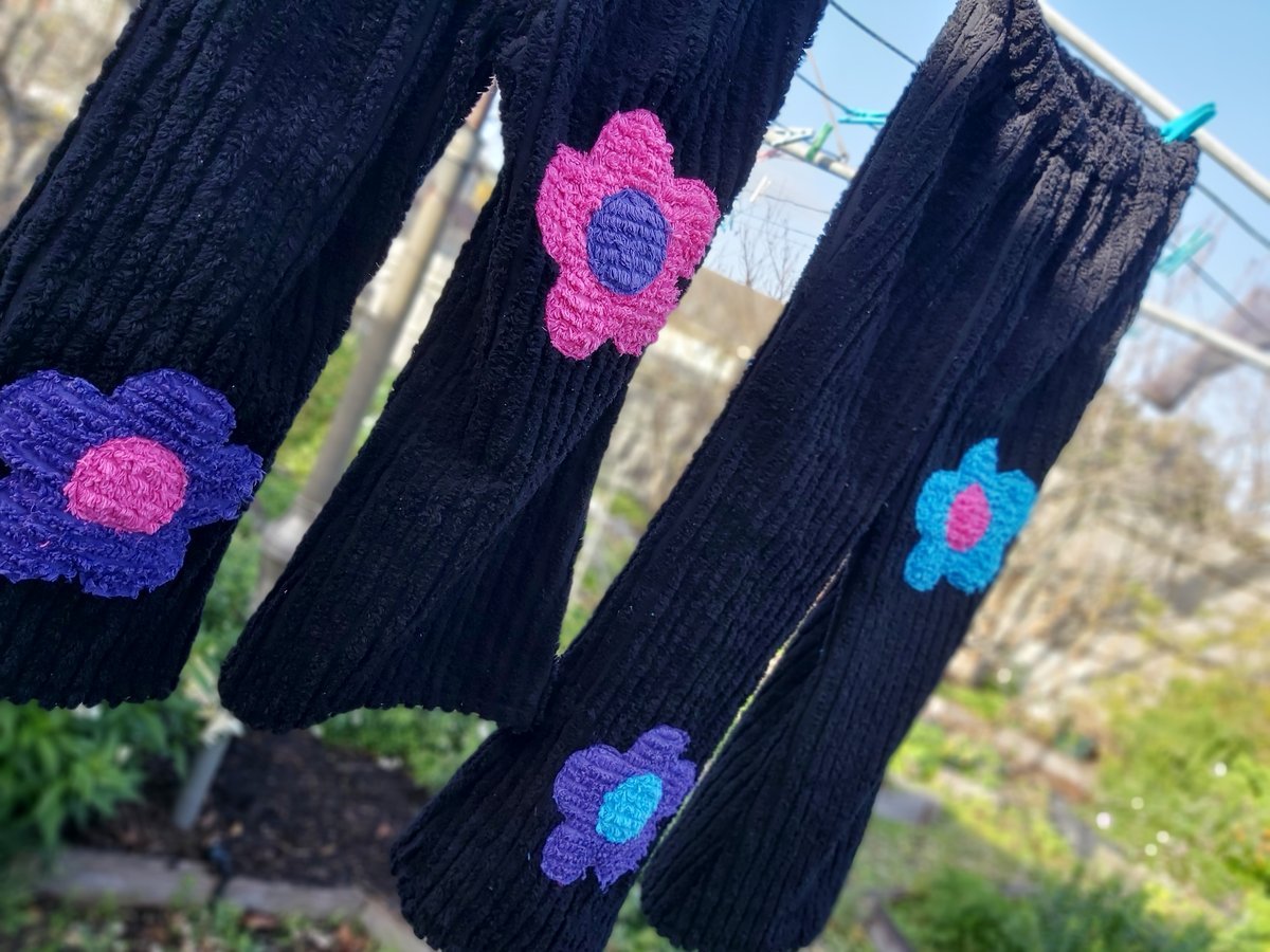Image of Black chenille flower pants with pink, blue and purple flowers