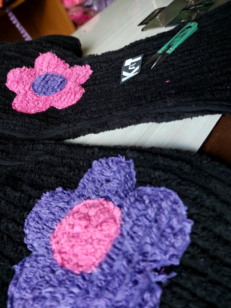 Image of Black chenille flower pants with pink, blue and purple flowers
