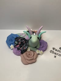 Image 1 of Little flower snuggling dragon x 005