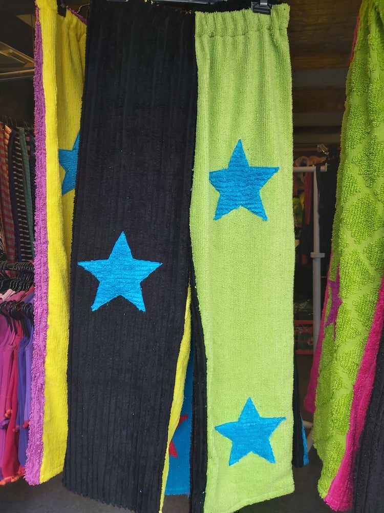 Image of Chenille pants and shorts. Black/green with blue stars
