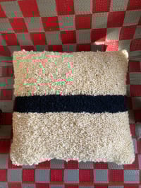 Image 3 of strikethrough cushion
