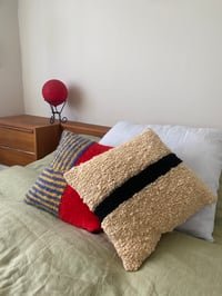 Image 2 of strikethrough cushion