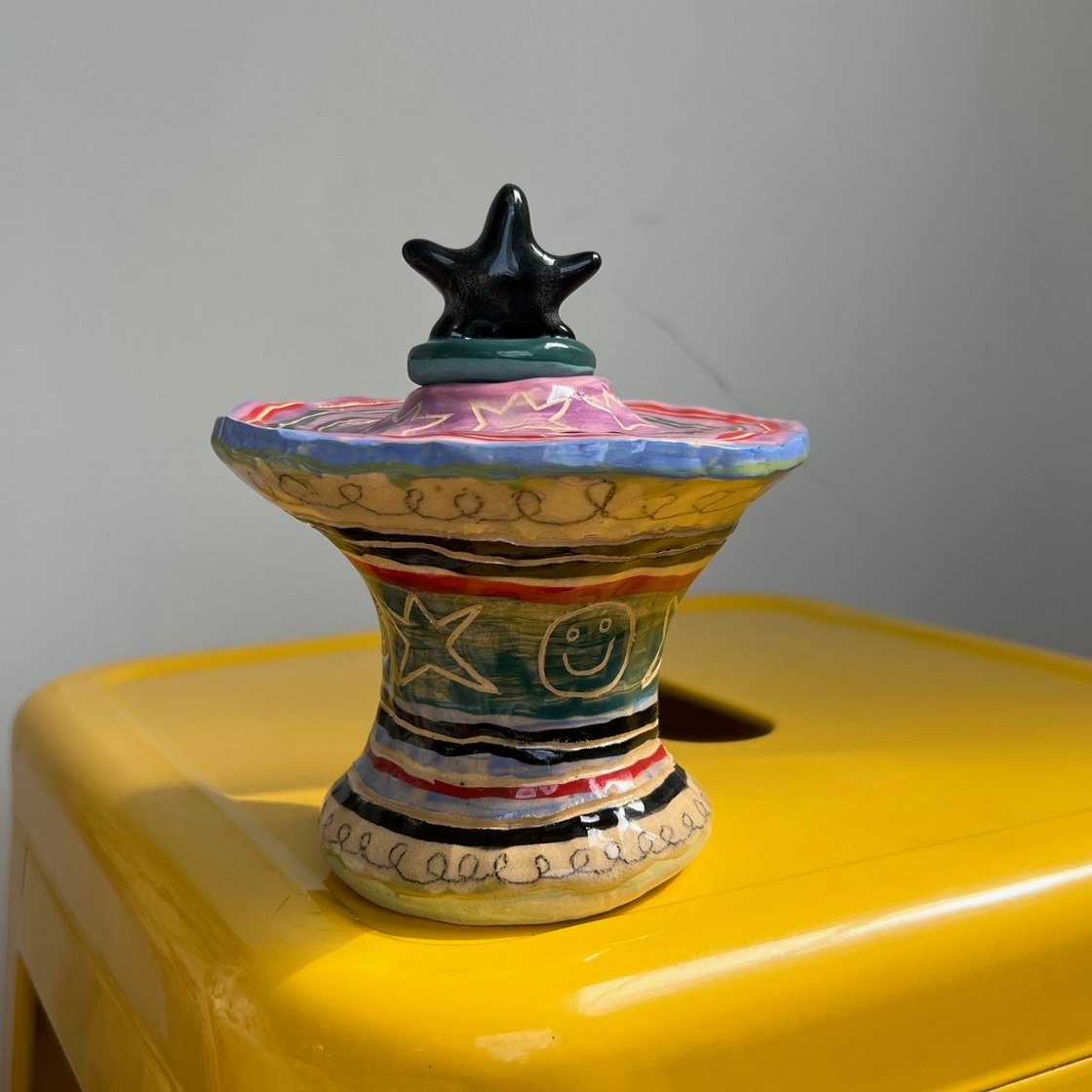 Image of striped lidded vessel