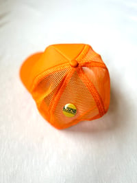 Image of from the inside out trucker cap in orange 