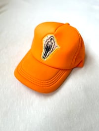 Image of from the inside out trucker cap in orange 
