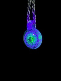 Image 4 of UV reactive glow flower with flower of life dichro image, illuminati over opal lime bale.