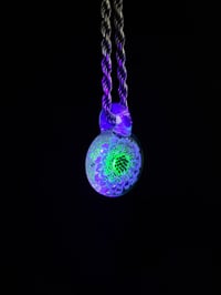 Image 5 of UV reactive glow flower with flower of life dichro image, illuminati over opal lime bale.