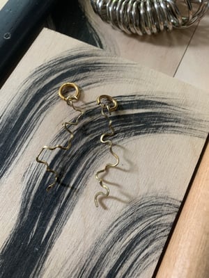 Image of "Whirl on" brass wiggly hoops