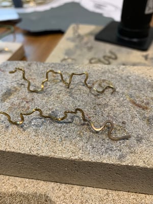Image of "Whirl on" brass wiggly hoops