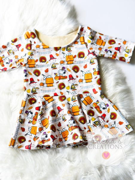 Image of Charlie Brown Peplum Top 