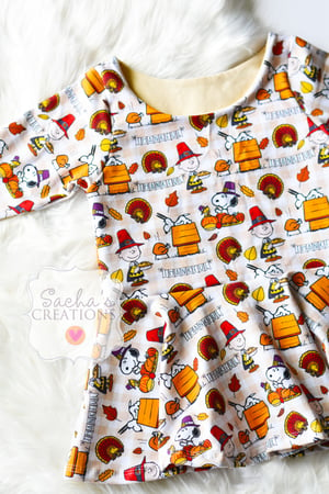 Image of Charlie Brown Peplum Top 