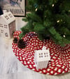 30" red and cream Christmas tree skirt for an artificial tree rug made from braided cotton jersey