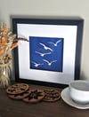 Seagulls flying framed papercut