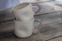 Image 2 of White mug / colored handle. 