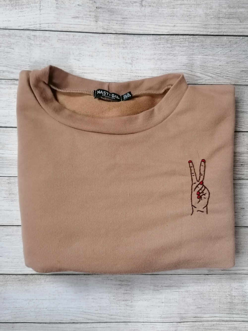 Image of peace sign crop jumper