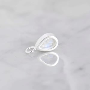 Image of Rainbow Moonstone pear shape cabochon cut silver necklace
