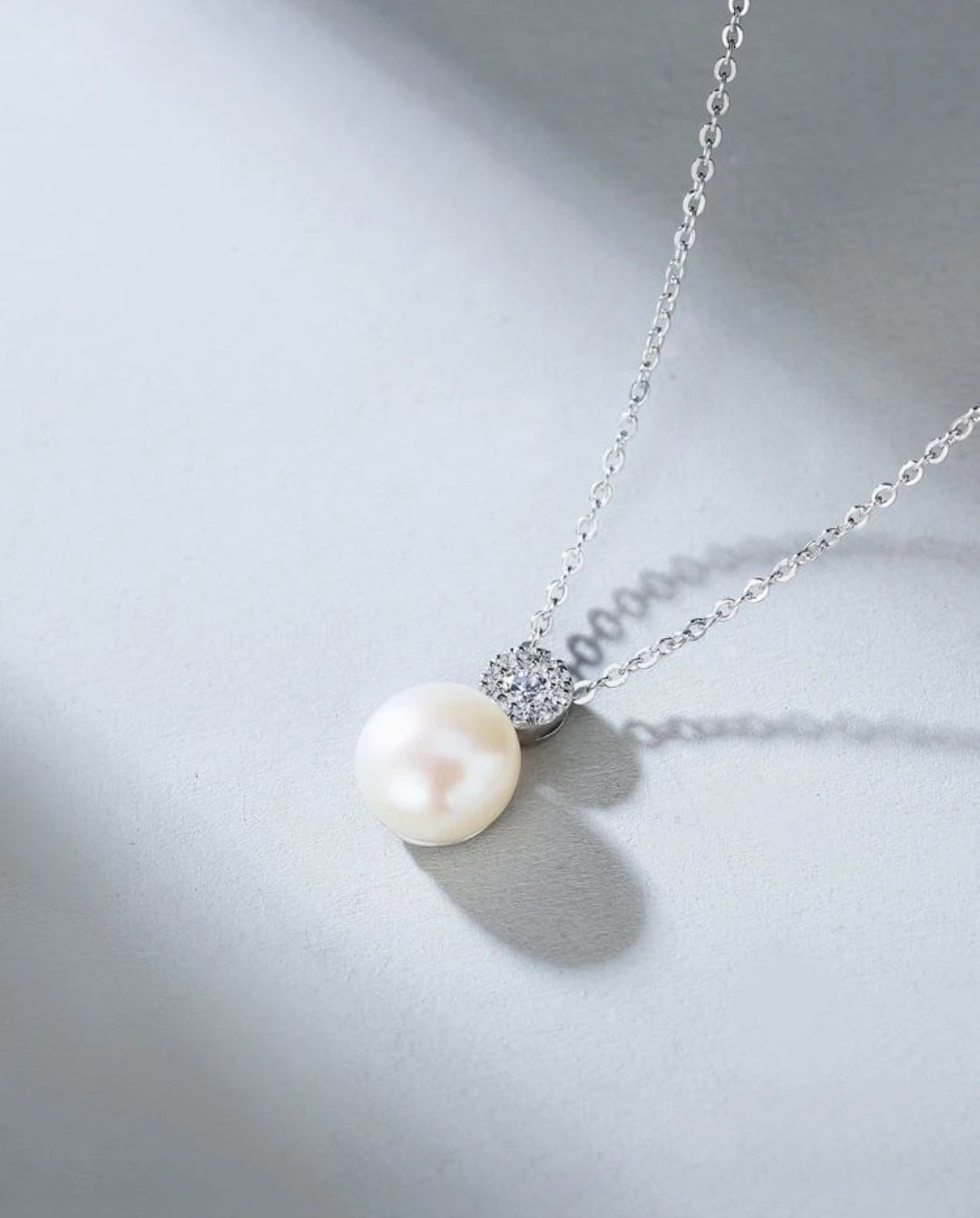 Image of Round CZ and natural pearl 