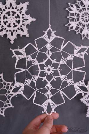 Image of Elegant Christmas decoration - snowflakes and wood mobile