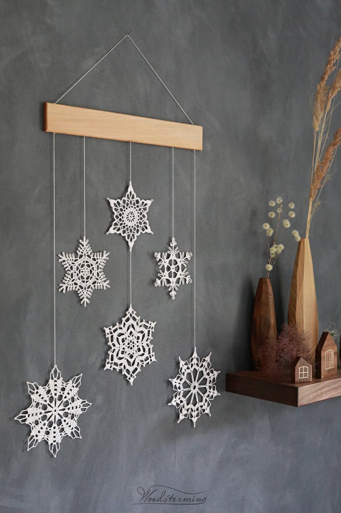 Image of Christmas wall art, snowflakes and beech wood mobile