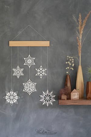 Image of Christmas wall art, snowflakes and beech wood mobile