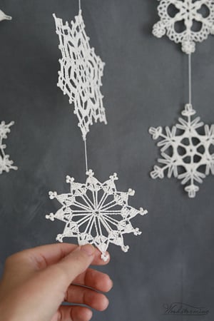 Image of Christmas decoration, snowflake and wood ornament, unique festive holiday decor