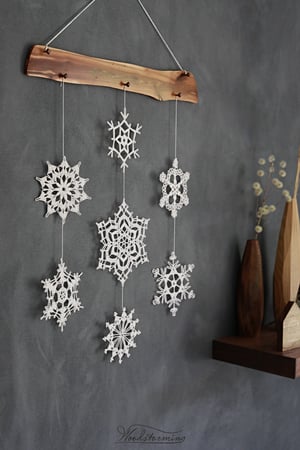 Image of Christmas decoration, snowflake and wood ornament, unique festive holiday decor
