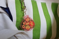 Image 1 of orange bag keychain