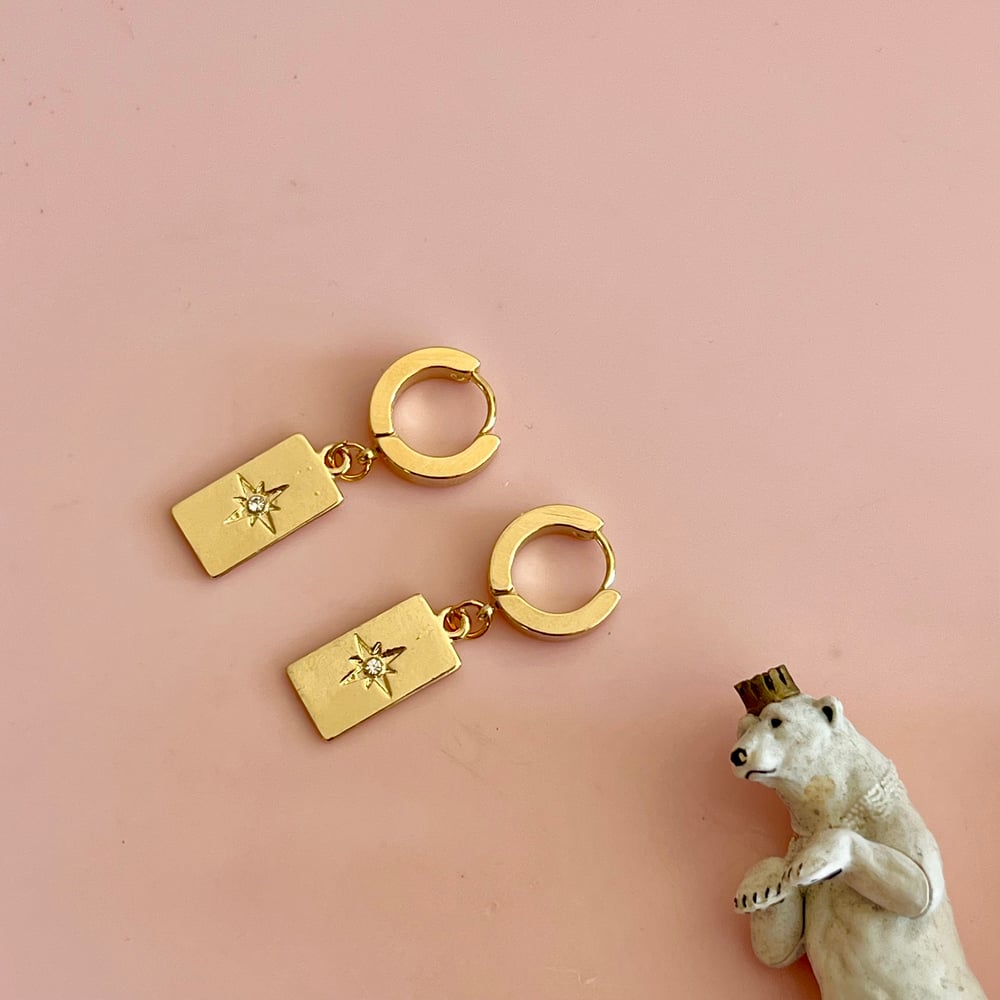 Image of Long Gold Rectangle Star Huggie Hoops 