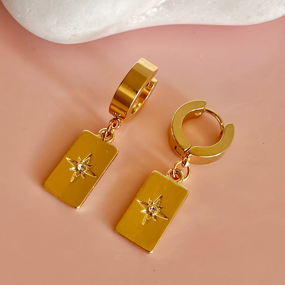 Image of Long Gold Rectangle Star Huggie Hoops 