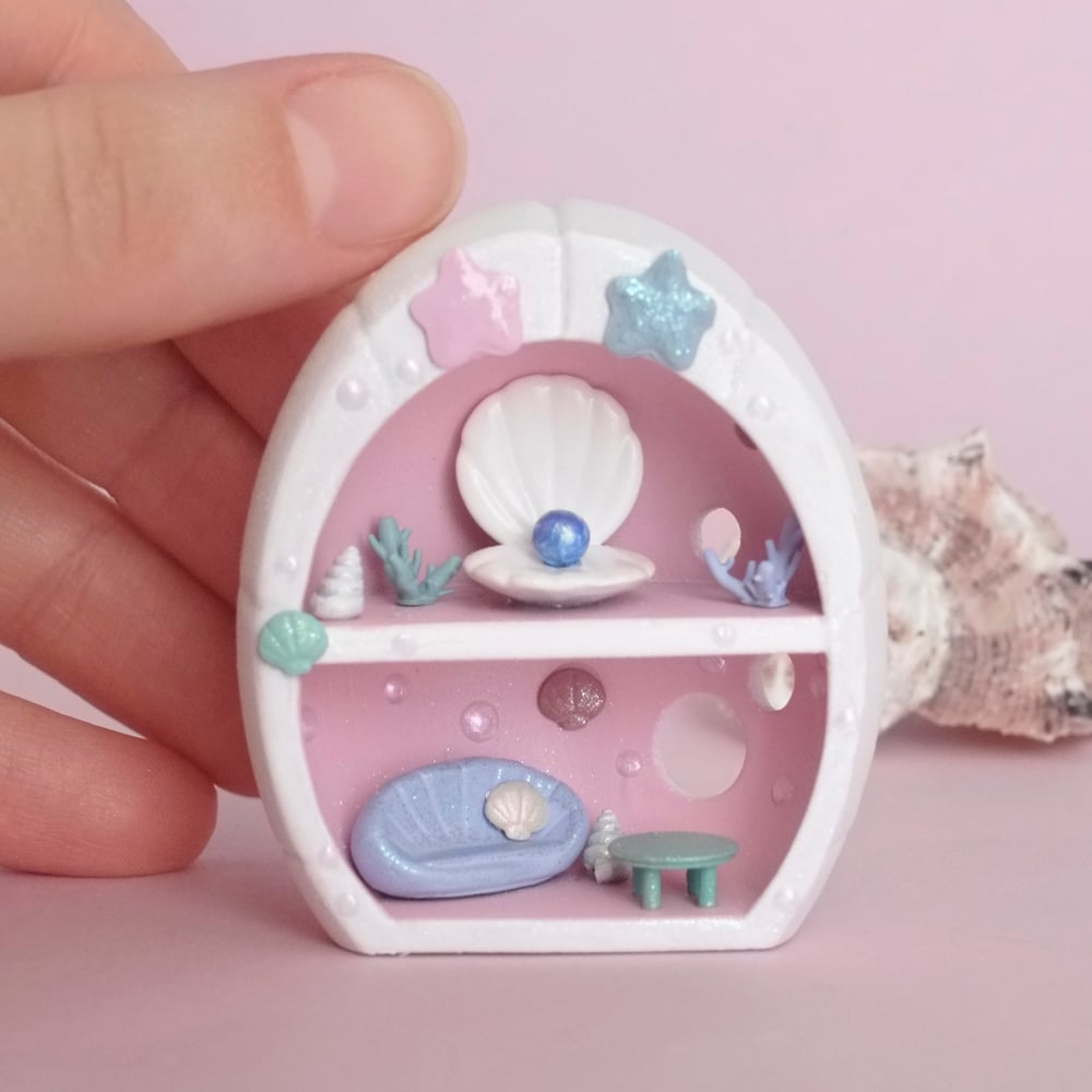 Pink miniature shell house