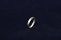 Unique, handmade 18ct gold ring formed from shaped, geometric tapering D-shaped wire