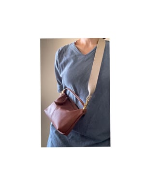 Image of convertible leather crossbody + pouch 