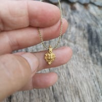 Image 1 of Tiny Vintage Gold Amulet