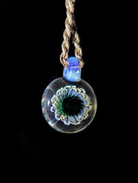 Image 1 of Uv reactive glow flower pendant.