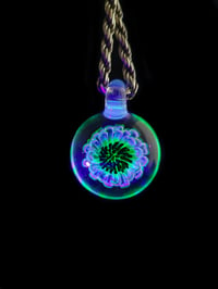 Image 3 of Uv reactive glow flower pendant.