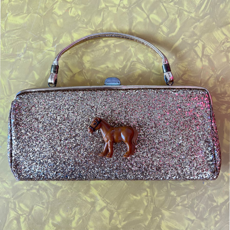 Image of MegaGlam Landfill Luxuries Glitter Pony Clutch