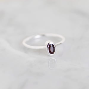 Image of Wine Red Garnet oval cut silver ring