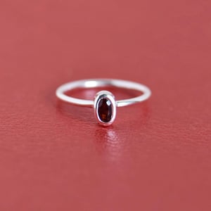 Image of Wine Red Garnet oval cut silver ring