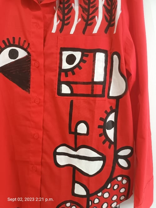 Image of red painted shirt...small
