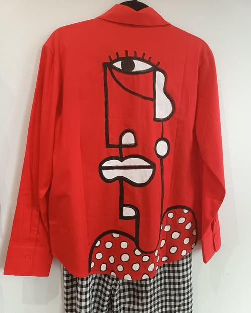 Image of red painted shirt...small
