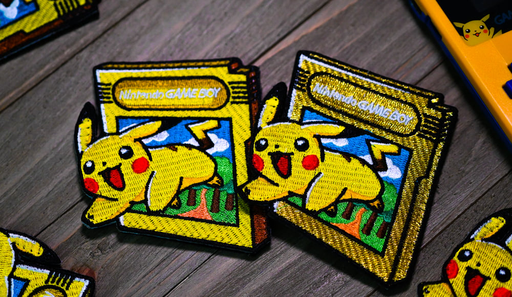 Image of OUT OF THIS GAME "PIKACHU" V1 YELLOW (3 LEFT)