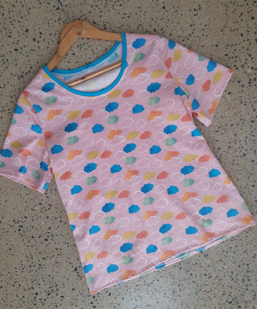 Image of Pink Cloudy Day TEE. Available in size Small, Large & Extra Large