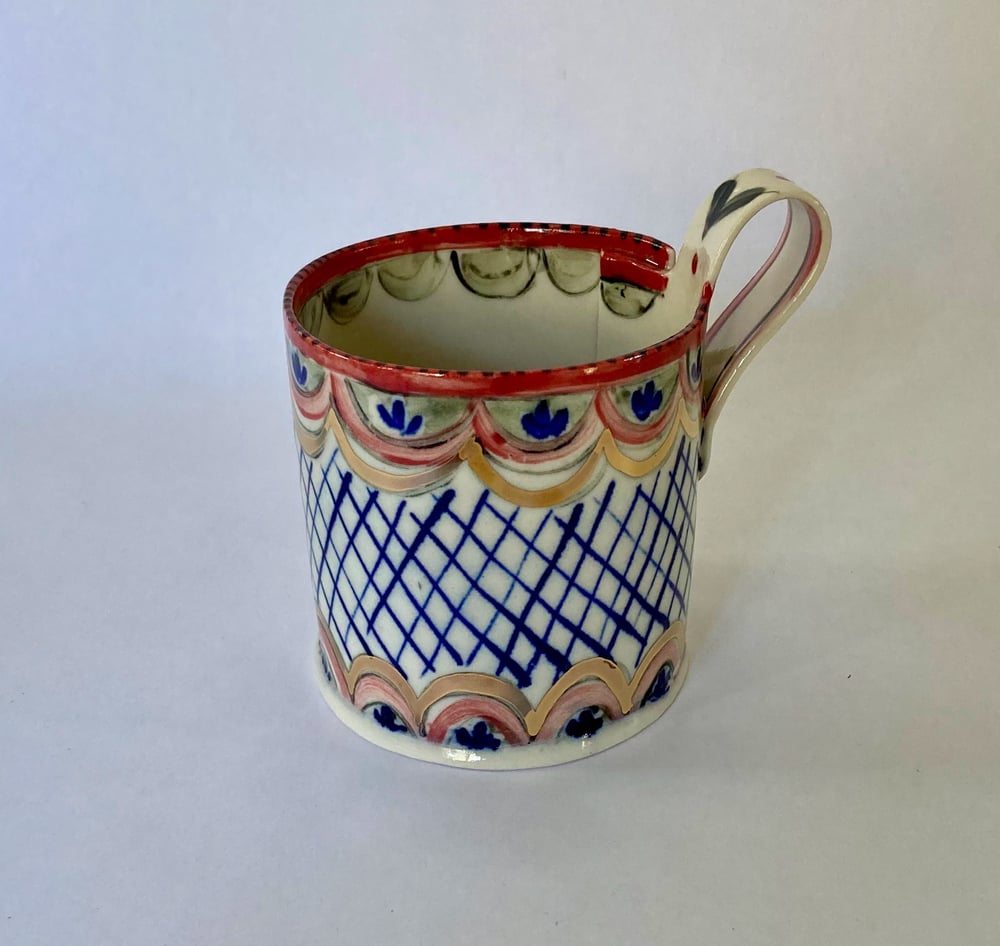 Image of Teacup and saucer red blue gold