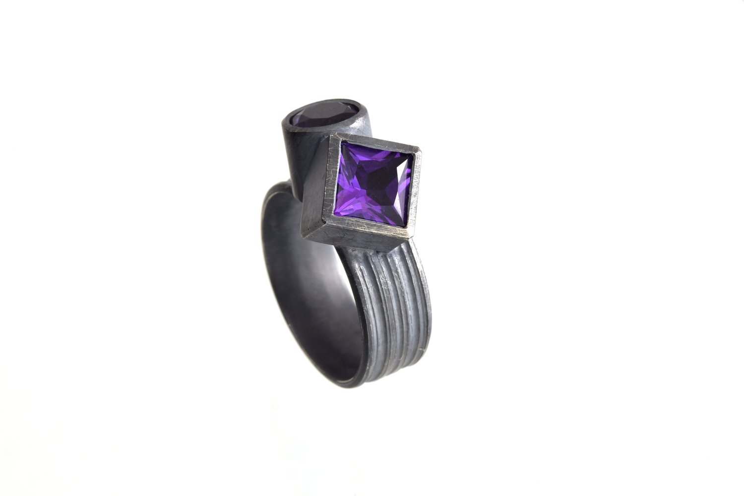 Amethyst twinned ring in oxidised silver. Princess cut and round