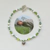 green folklore inspired metal heart necklace