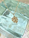 14K diamond monstera leaf pendant