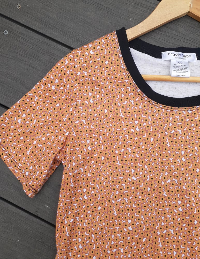 Image of DAISY DOT TEE. AVAILABLE in L & XL.