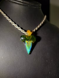 Image 3 of Silver fume & stardust shark tooth pendant with blue stardust over orange top.