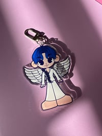 Image 3 of jimin and tae winged keychains.