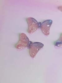 Image 1 of UV bow charm 